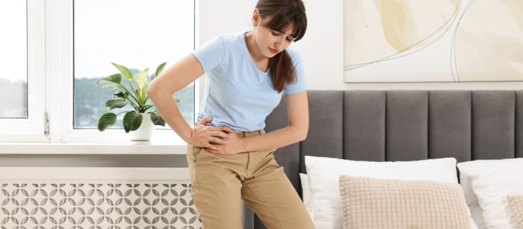 Hip Pain Holding You Back? What to Expect from Hip Replacement Surgery in Victoria 1 Woman experiencing hip pain at home.